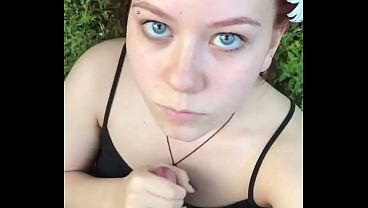 Redhead slut gives a nasty blowjob deep in the forest Video